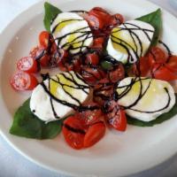 Caprese Salad · Fresh mozzarella cheese, fresh cherry tomatoes, fresh basil, extra virgin olive oil, and a b...