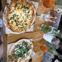 Margherita Pizza · House Made Red Sauce, Mozzarella, Basil

CONTAINS: Gluten, Dairy, Allium
