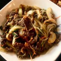 Japchae · Glass noodles, red peppers, carrots, spinach, mushrooms and thinly sliced marinated beef fla...