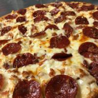 Gourmet Chicken Pizza · Alfredo sauce, chicken, all beef pepperoni, bacon, and garlic; sprinkled with crushed red pe...