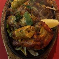 Tandoori Chicken · Spring chicken with a mace and saffron marinade. Served as meals with vegetable biryani and ...