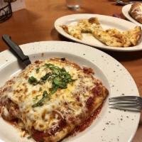 Rolled Lasagna · A mixture of our house marinara sauce, ricotta, cheese, ground beef and pork, rolled inside ...
