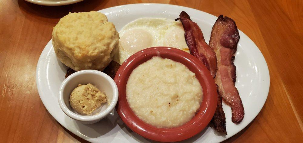 Southern Breakfast · 2 eggs any style, stone-ground grits, applewood-smoked bacon, buttermilk biscuit and a fried green tomato.