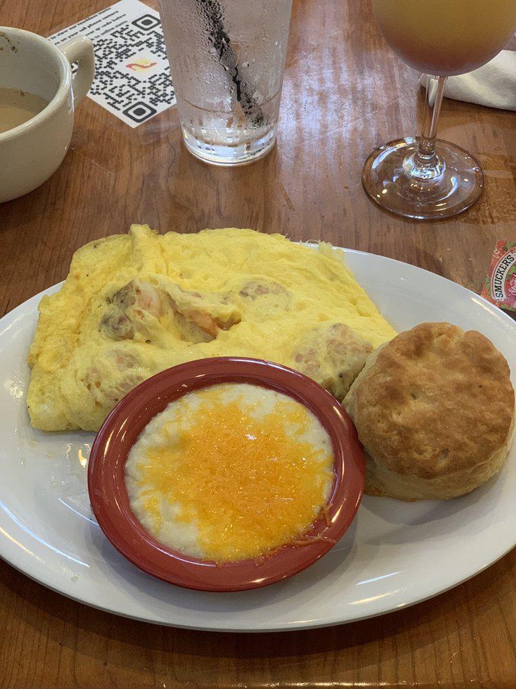 Gulf Shrimp Omelet · Gulf shrimp and cheddar cheese omelet, served with a buttermilk biscuit and choice of side