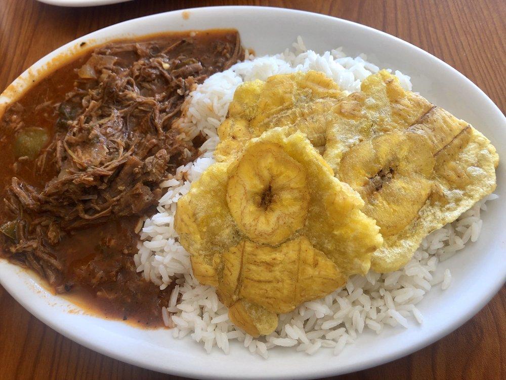 Cuban Ropa Vieja · Shredded beef, rice, black beans and tostones.