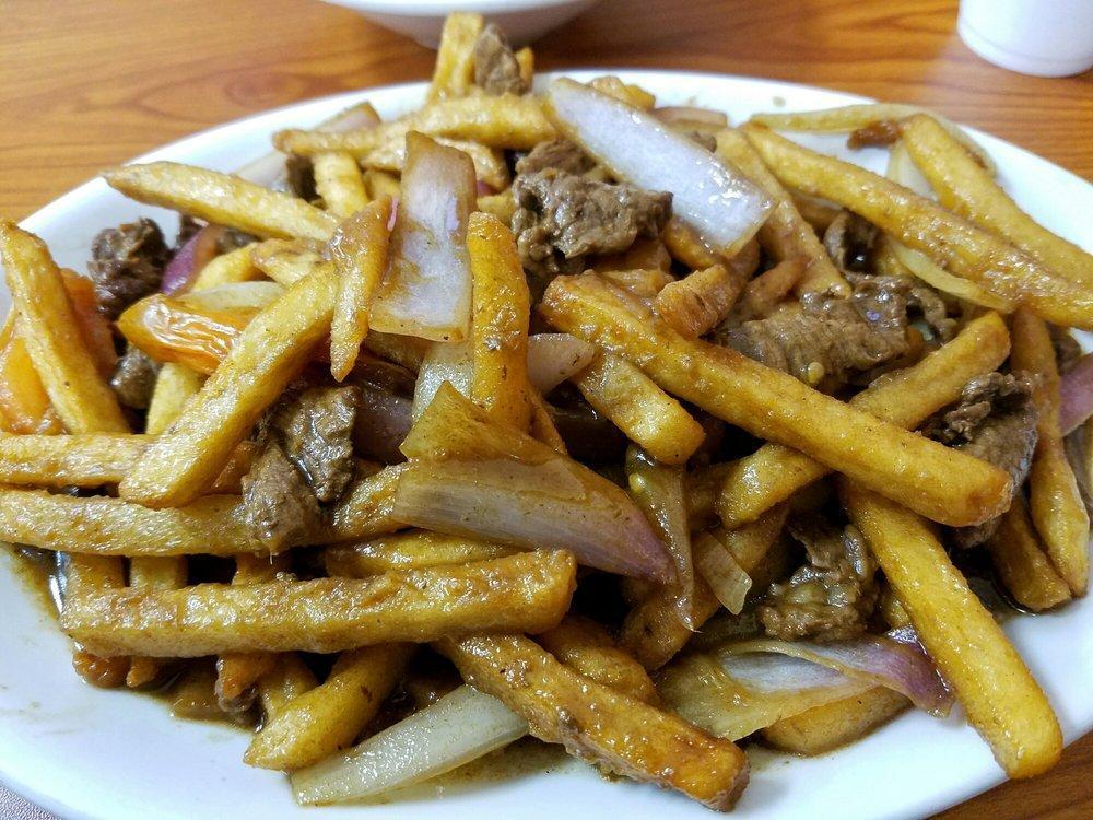 Peruvian Lomo Saltado · Peruvian stir-fried beef and fries with rice. 