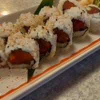 Spicy Crunchy Tuna Roll · Mixed spicy tuna, avocado, and tempura flakes topped with tuna.