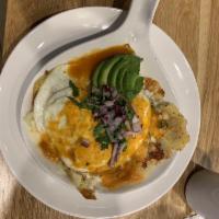 Huevos Rancheros · A grilled corn tortilla topped with two eggs over medium and our homemade ranchero sauce. Se...