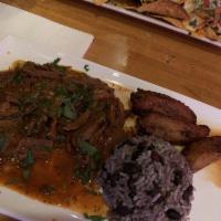 Ropa Vieja Special · Shredded beef stewed with tomato sauce. Served with rice, black beans, and fried plantains.
