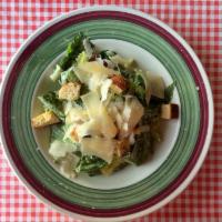 Caesar Salad · Romaine lettuce with Caesar dressing, homemade fresh croutons and shaved imported Reggiano P...