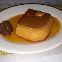 Flan · Homemade Argentinian flan in caramel sauce with dulce de leche and cream.
