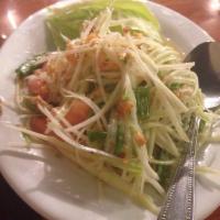 Papaya Salad · Shredded papaya, tomatoes, green beans, peanuts, and dried shrimp tossed in lime dressing an...