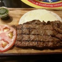 Carne Asada · Grilled steak, with your choice of 1 side, 1 slice of tomato, and chimichurri.