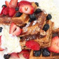 Churro Waffle · Classic Belgium waffle turned into a churro. Topped with fresh strawberries, blueberries, ca...