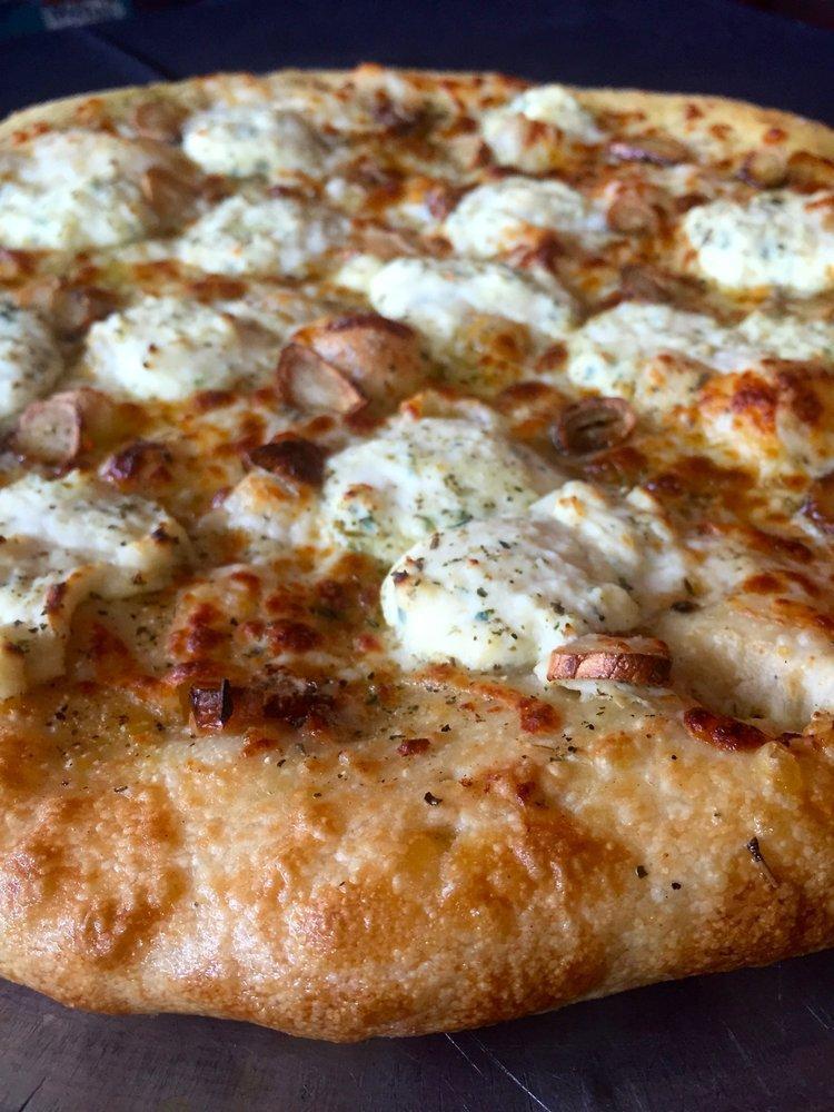 White Pizza · Garlic butter, mozzarella cheese, ricotta cheese, roasted garlic, Tuscan extra virgin olive oil and spices.