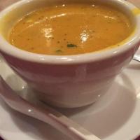 Mulligatawny Soup · Made with lentils, tomatoes and a touch of specially blended spices and herbs. 