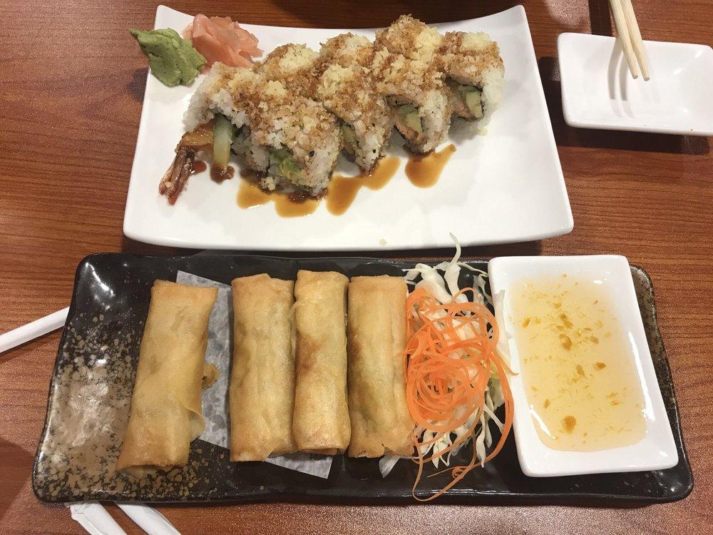 Buddy Crunch Roll · Shrimp tempura, salmon tempura, avocado, cucumber, and spicy mayo inside with tempura flakes, and eel sauce on top.