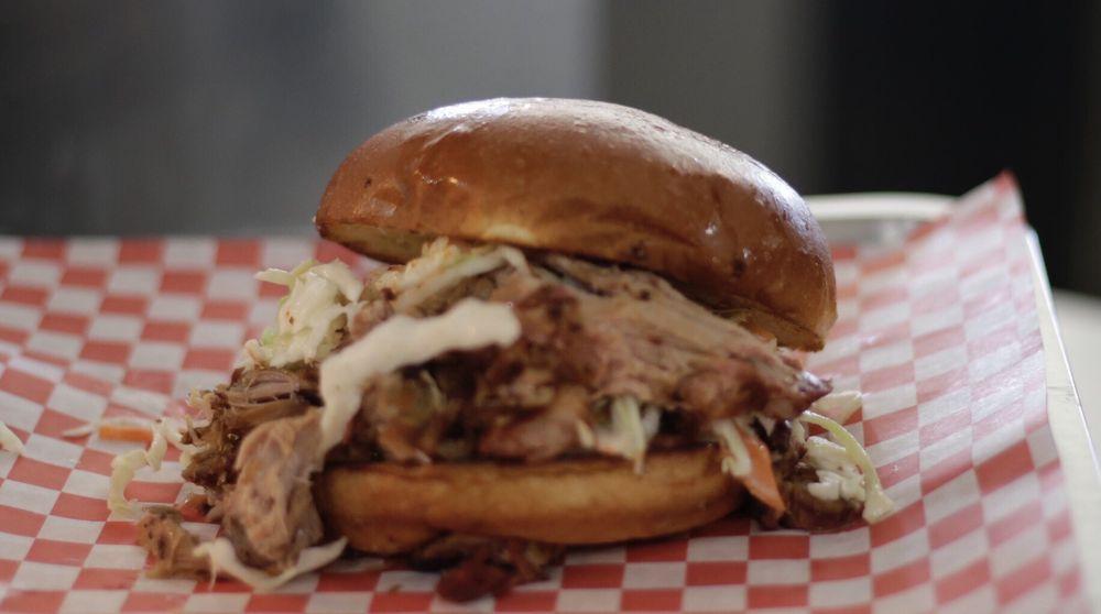 Pulled Pork Sandwich · Smoked pulled pork, coleslaw and BBQ sauce.
