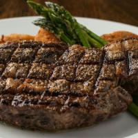 Ribeye · 14 oz. ribeye grilled to order with a twice-baked potato and chefs seasonal vegetables, serv...