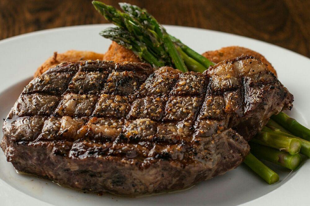 Ribeye · 14 oz. ribeye grilled to order with a twice-baked potato and chefs seasonal vegetables, served with zip sauce