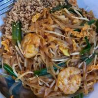 Pad Thai · Thai glass noodles with chicken, shrimp, bean sprouts, onions, eggs, ground peanuts with tam...