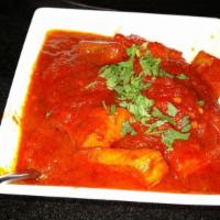 Chicken Vindaloo · White meat chicken cooked with potatoes in a highly spiced tangy hot sauce.