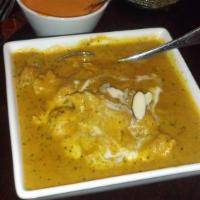 Chicken Korma · Boneless white meat chicken simmered in a mild cashew sauce, garnished with raisins and cash...