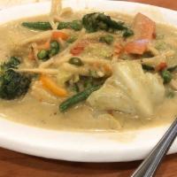 Green Curry · Cooked in green curry sauce, bamboo shoots, bell peppers, and sweet basil.