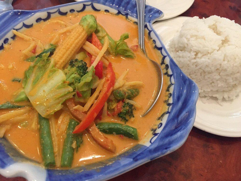 Red Curry · Cooked in red curry sauce, bamboo shoots, bell peppers, carrot, and sweet basil.