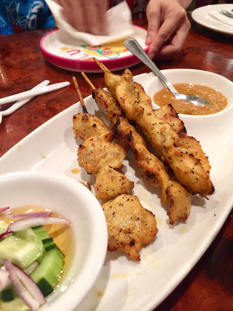 Chicken Satay · Marinated and grilled chicken on skewers, served with peanut sauce and cucumber salad.