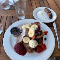 French Toast · Thick slices of our brioche bread served with homemade raspberry jam.