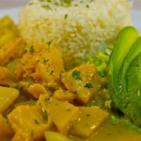 Guatita · Honey comb tripe, diced potatoes, peanut butter sauce served with rice 
and lettuce