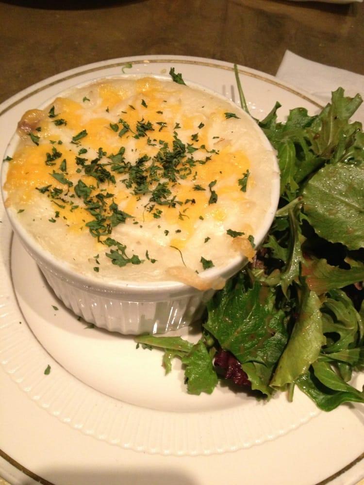 Shepherd's Pie · Minced beef simmered with herbs, peas and carrots topped with mashed potatoes and melted cheese 