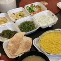 The Olive Mediterranean Combo · Hummus, tabouleh, baba ghanoush, yogurt salad, feta cheese, cucumbers, tomatoes, olives and ...