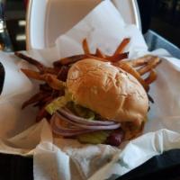 Monster Burger · 1/4 lb. patty, American cheese, bacon, mayo, lettuce, tomato, onion, and pickles.