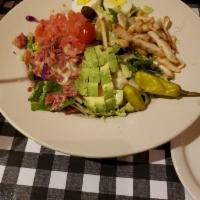 Cobb Salad · Chopped salad with fresh tomatoes, bacon, boiled egg, avocado, chicken, and cheese with choi...