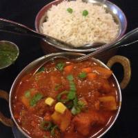 Chicken Vindaloo · Premium chicken breast cubes cooked in special sauce with herbs and spices. Served with basm...