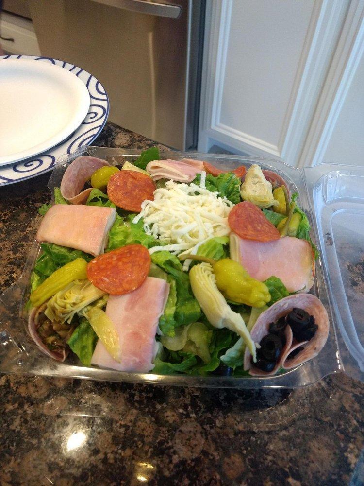 Antipasto Salad · Crisp romaine hearts with Genoa salami, mozzarella, provolone, hot coppa ham, sauteed, mushrooms, artichoke hearts, black olives and pepperoncinis. Topped with strips of Parm prosciutto. Choice of dressing. Large.