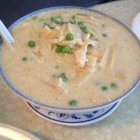 Green Curry · Green peas and bamboo shoots simmered in coconut milk, topped with fresh basil and sliced be...