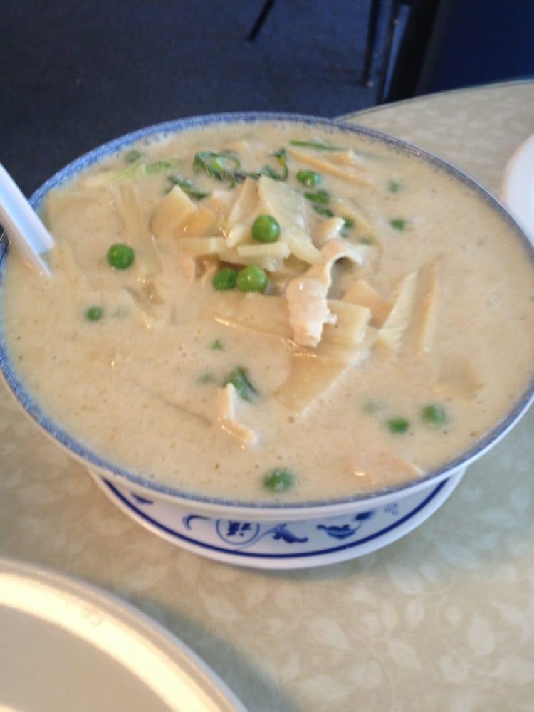 Green Curry · Green peas and bamboo shoots simmered in coconut milk, topped with fresh basil and sliced bell peppers.