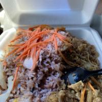 Mint Basil Fried Rice · Fried rice with egg, garlic, fresh basil, and onions. Topped with fresh carrots and onions.