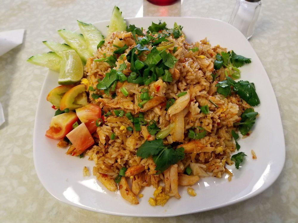 Crab Fried Rice · Fried rice with egg, garlic, and onions. Topped with fresh carrots and onions.