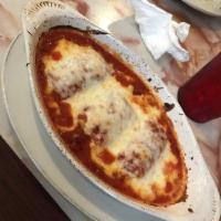 Cannelloni · Pasta rolled and stuffed with chicken and sauteed spinach topped with marinara and mozzarell...