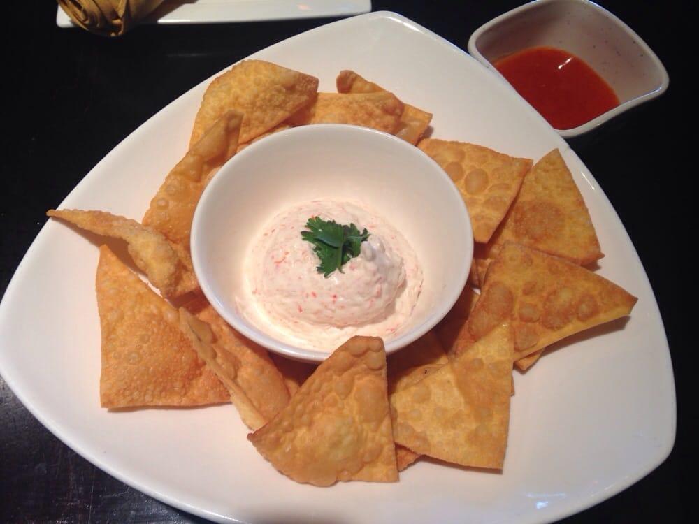 Crab Rangoon · Crab meat and cream cheese wrapped with wonton served with sweet chili sauce.