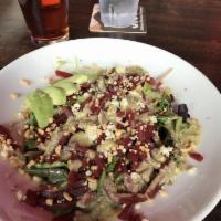 Beet Salad · Marinated beets with mixed greens, avocado, and chopped peanuts; topped with our housemade p...