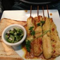 Satay · Tender chunks of skewered chicken grilled and served with peanut sauce and fresh cucumber re...