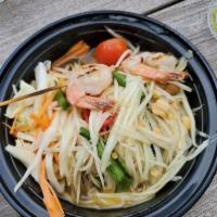 Papaya Salad Deluxe · Julienne green papaya, string beans, tomatoes and roasted peanuts mixed with spicy lime dres...