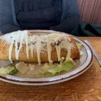 Deep Fried Burrito · Rice, beans, shredded cheese and your choice of chicken, shredded beef, 
green pork, or carn...
