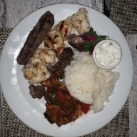 Mixed Grill · Shish taouk, lamb kebab, kafta, vegetables, and rice pilaf.