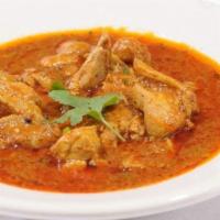Chicken Korma Boneless · Boneless chicken is cooked in an onion and tomato based sauce and spices. Served with 1 side...